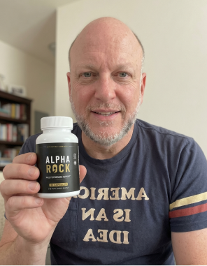 An adult man in an everyday home setting with the Alpha Rock supplement